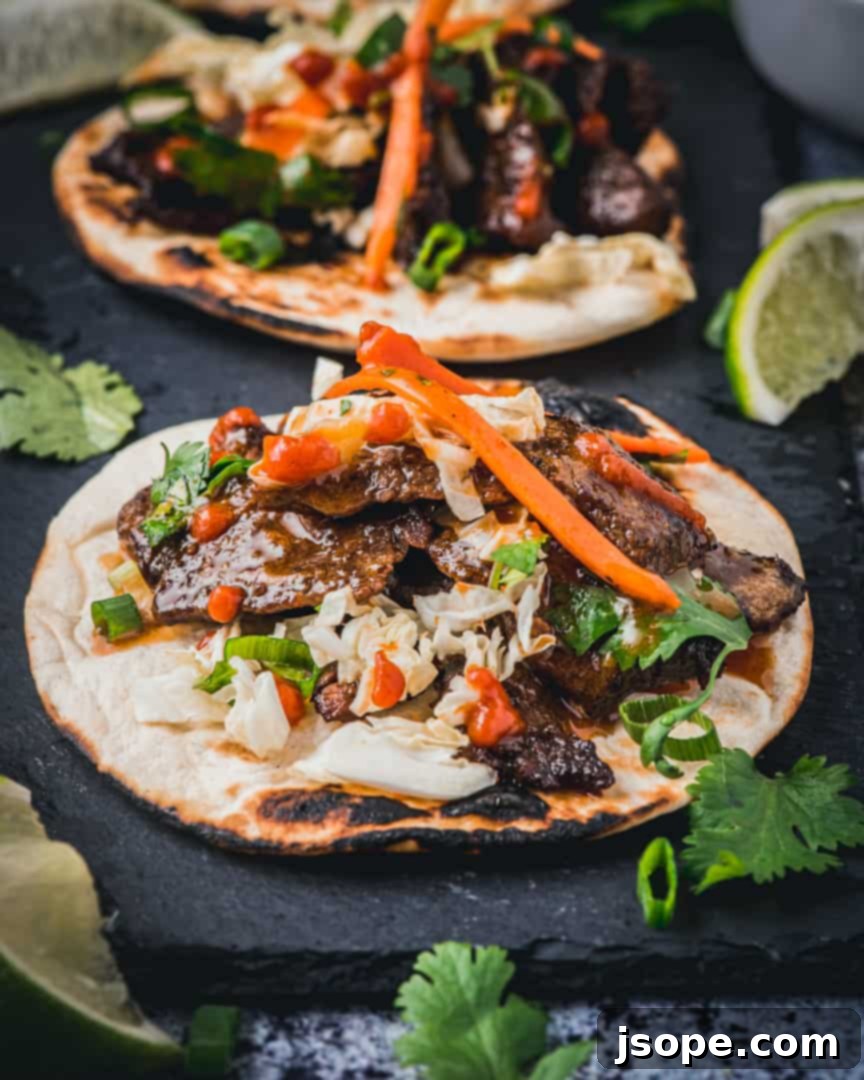 Korean Short Rib Tacos - Juicy, marinated beef in a soft tortilla with fresh slaw
