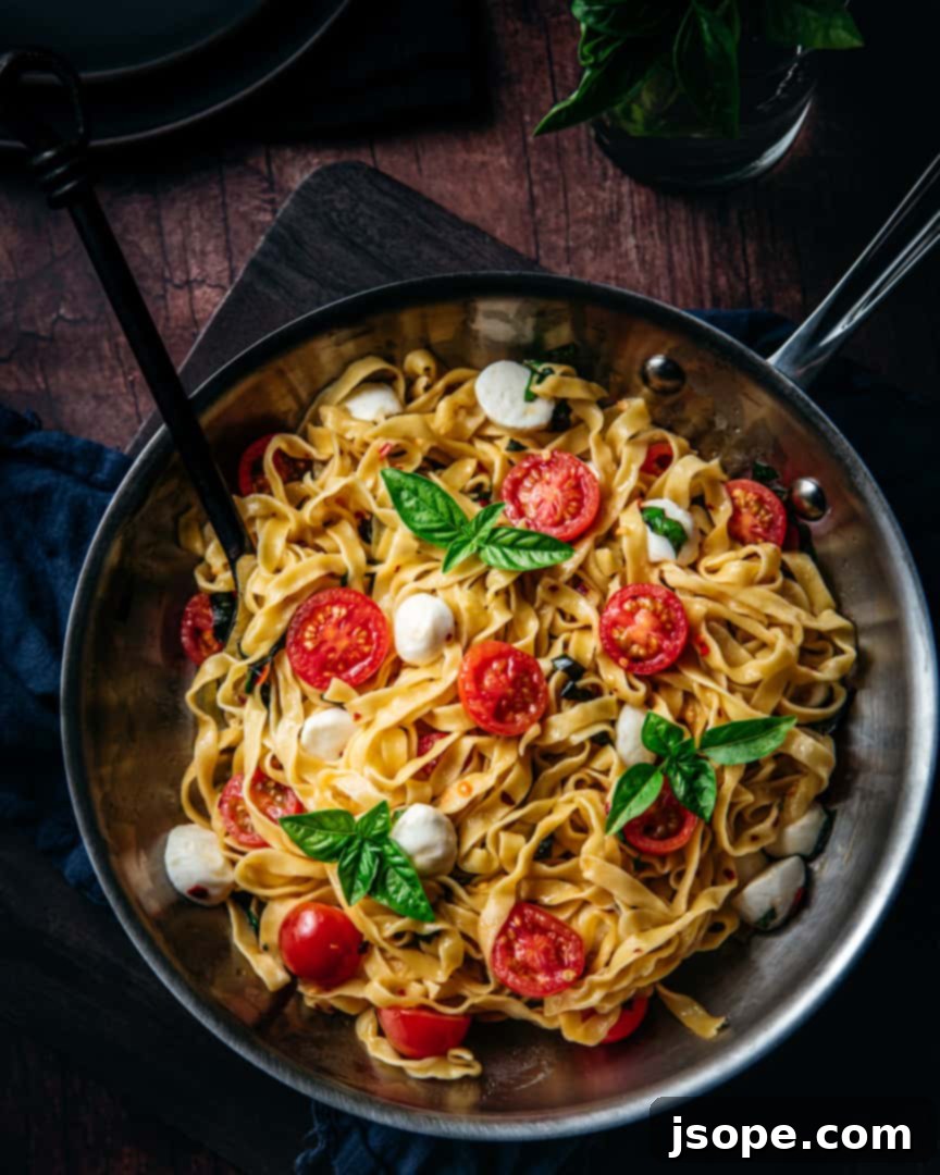 Pasta d'Estate (Summer Pasta) with fresh cherry tomatoes, mozzarella, and basil, ready to be served