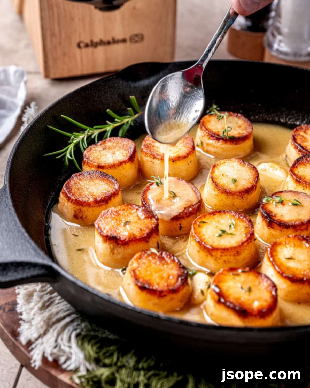 Fondant potatoes braising in the oven