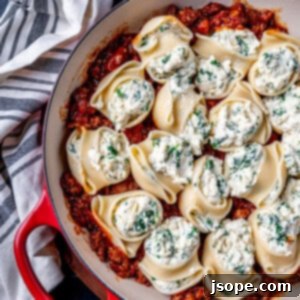 Three Cheese Stuffed Shells with Spicy Italian Sausage Sauce