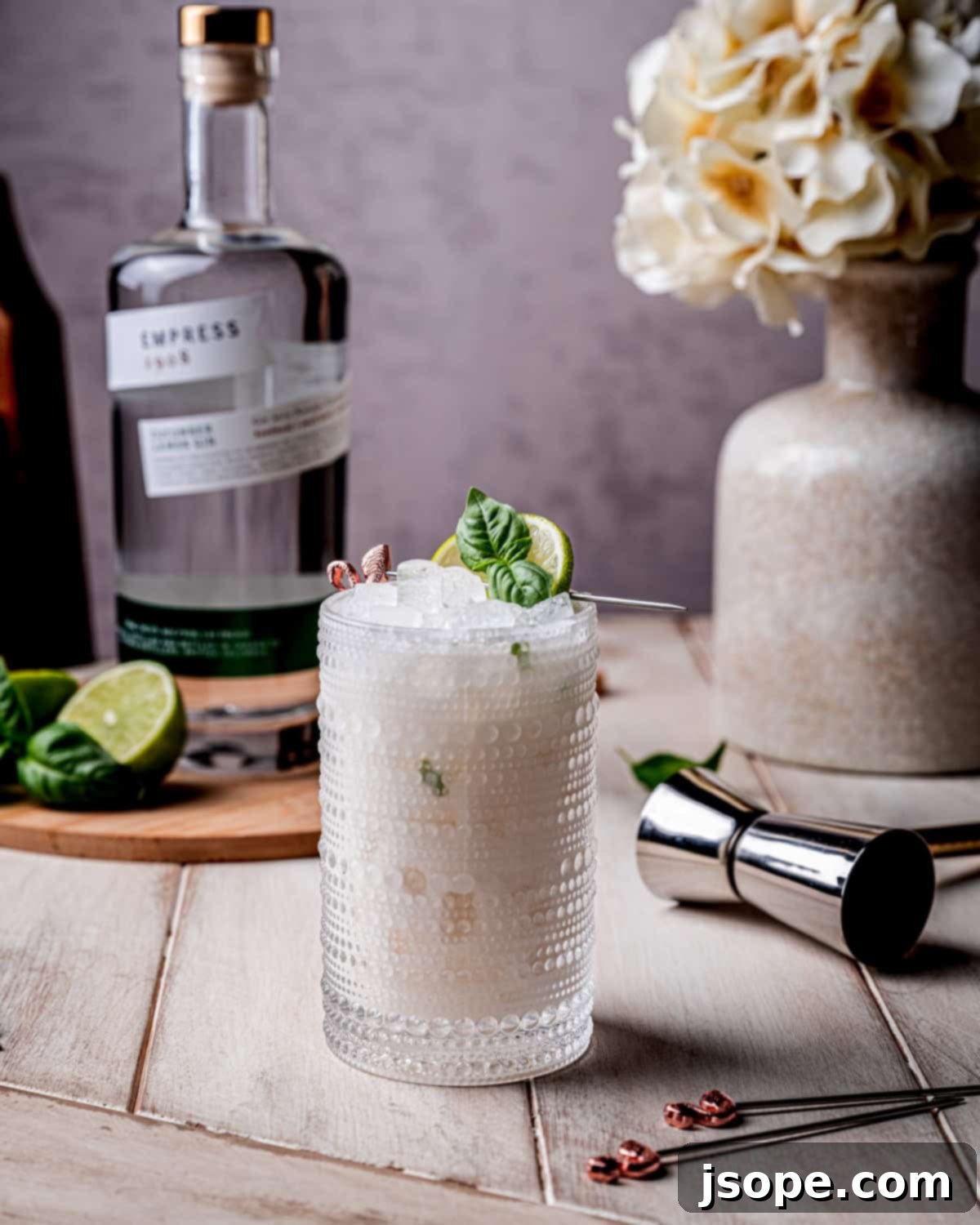 Four glasses of Shimmy Shimmy Coconut Basil Lime Gin Cocktail on a serving tray