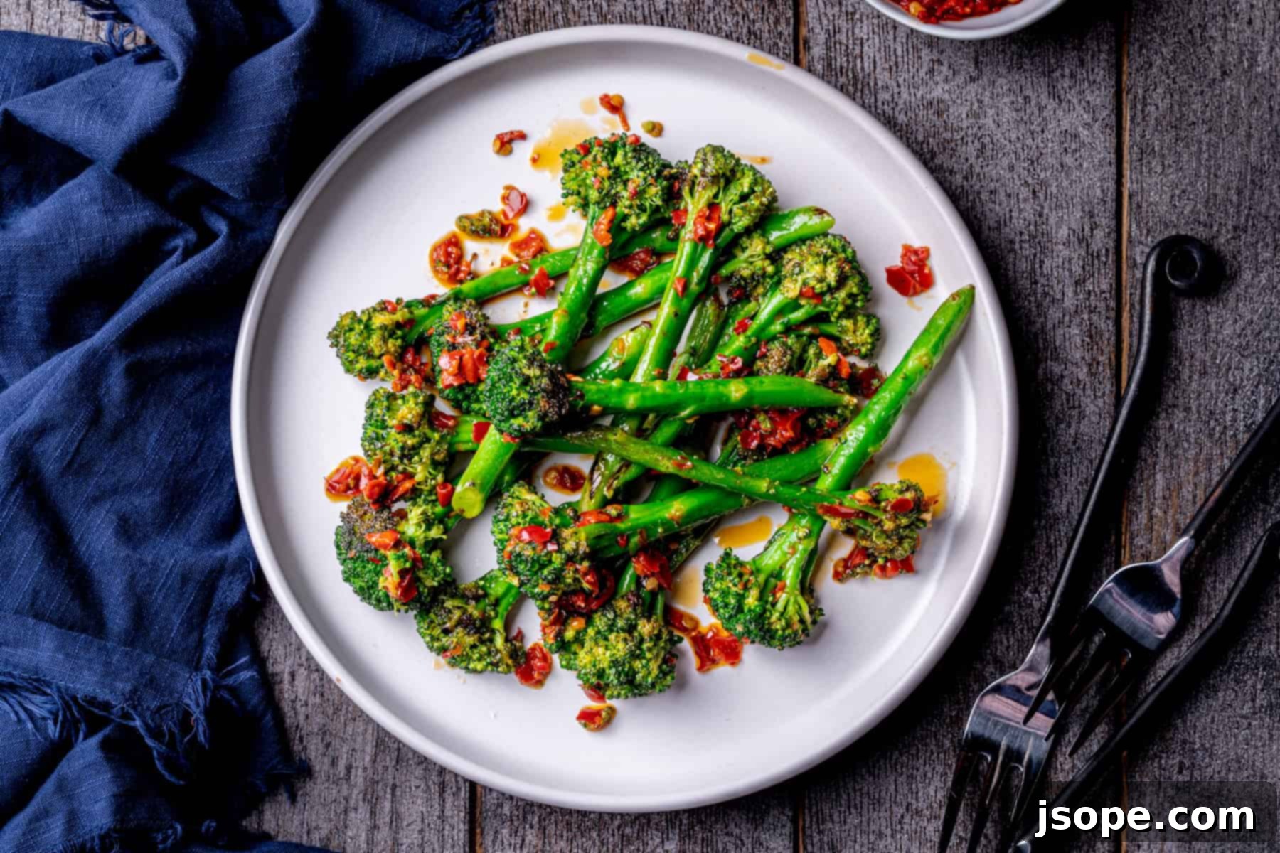 Beautifully arranged Spicy Charred Calabrian Chili Broccolini on a serving platter, ready to be enjoyed.