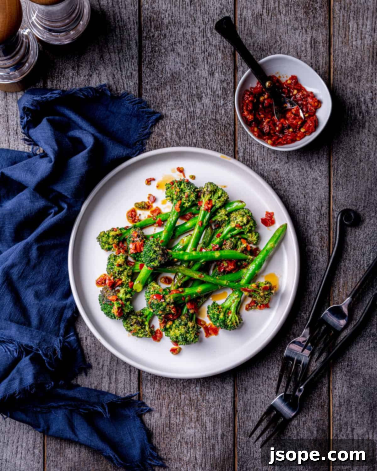 A serving of Spicy Charred Calabrian Chili Broccolini ready to be enjoyed as a vibrant and spicy side dish.
