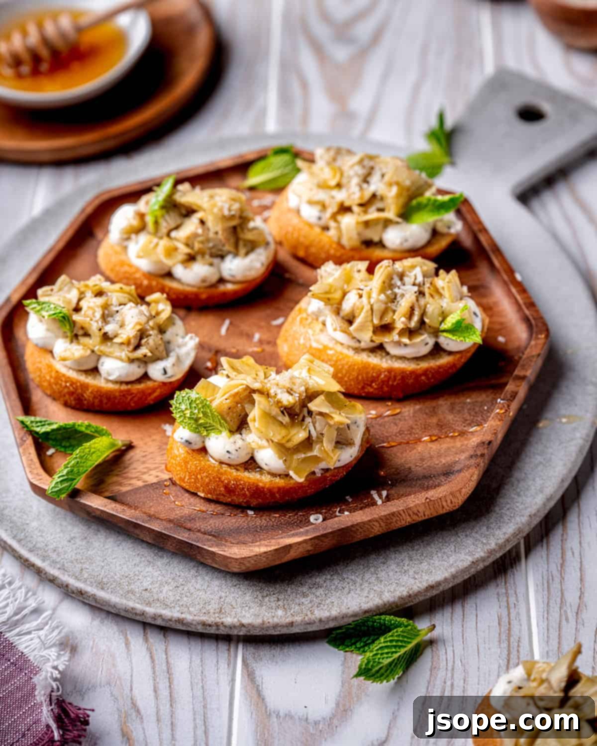 A beautifully presented Marinated Artichoke Hearts Crostini, ready for a feast.