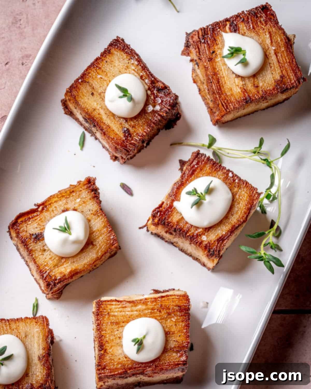 Perfectly golden-brown and crispy Potato Pavé squares, ready to serve