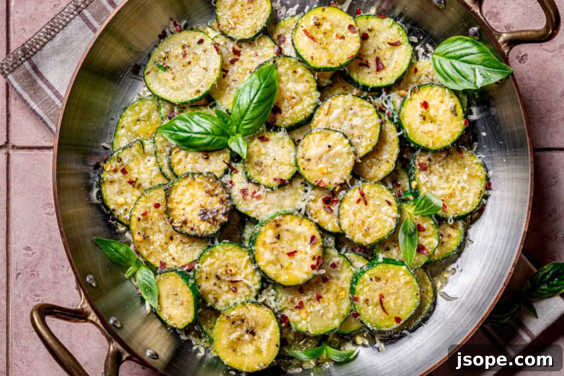Italian Herb Sautéed Zucchini Squash - serving on a white plate with fork