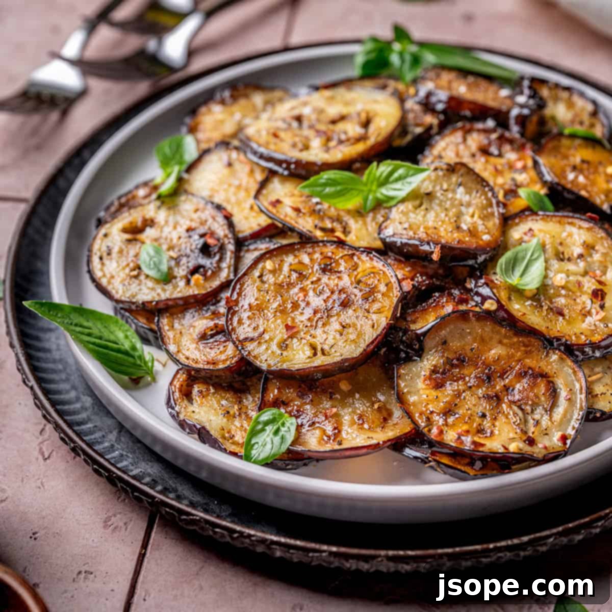 Garlic Herb Sautéed Italian Eggplant, golden brown and seasoned with fresh basil