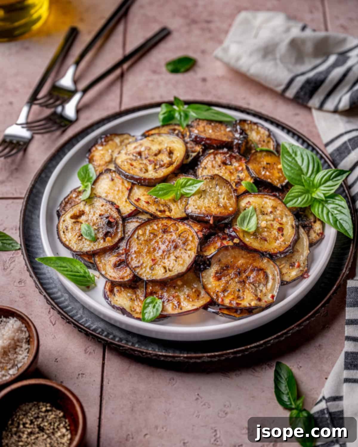 Garlic Herb Sautéed Italian Eggplant in a pan with spatula