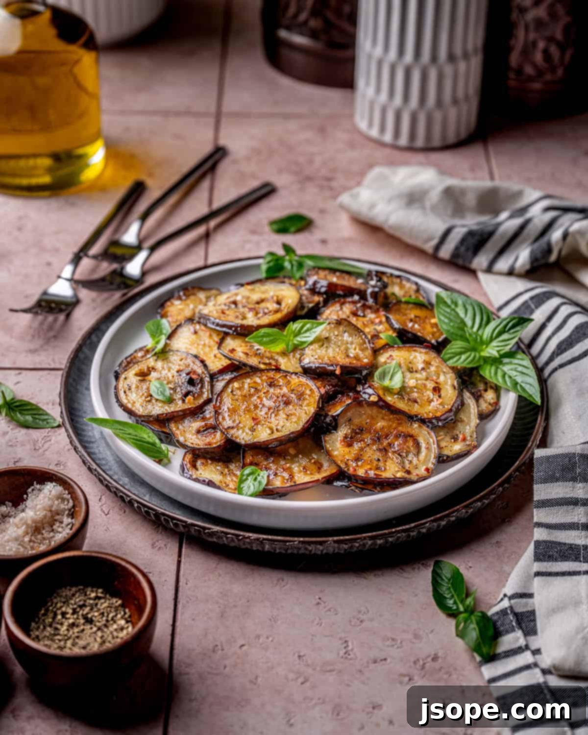 Large platter of Garlic Herb Sautéed Italian Eggplant with fresh basil