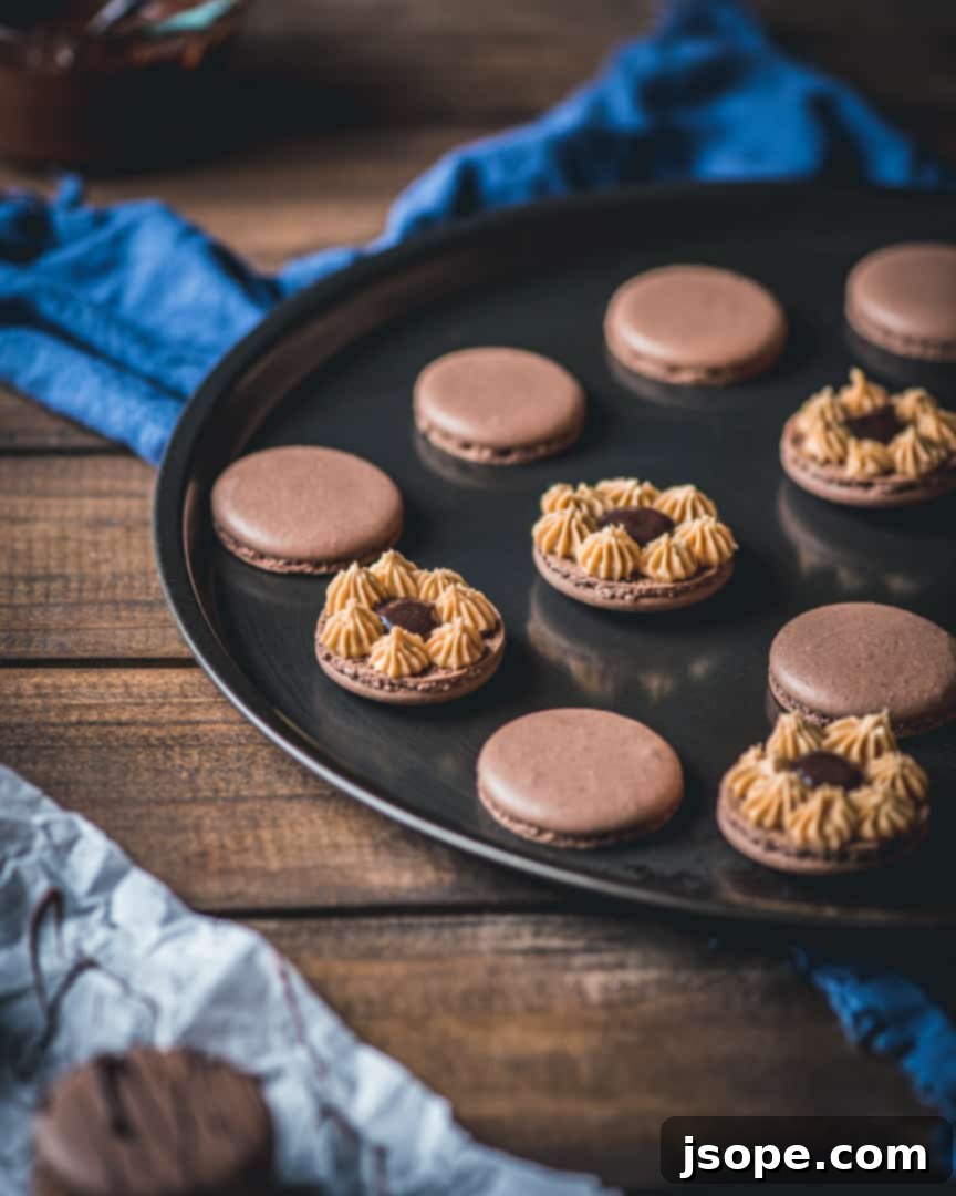 Peanut Butter Cup Macarons showing piped frosting