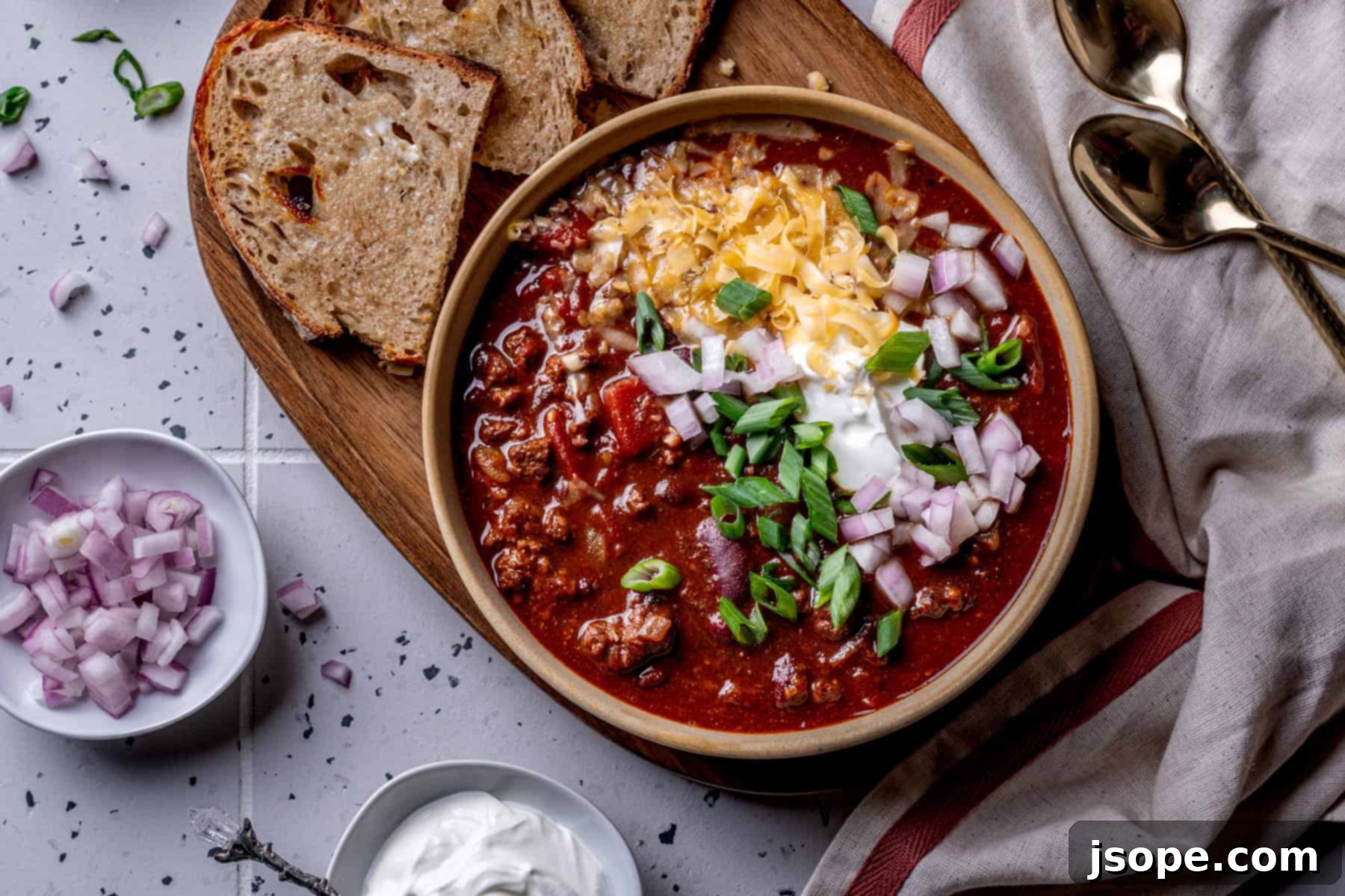 Large pot of homemade Chili with Kidney Beans, steaming hot.