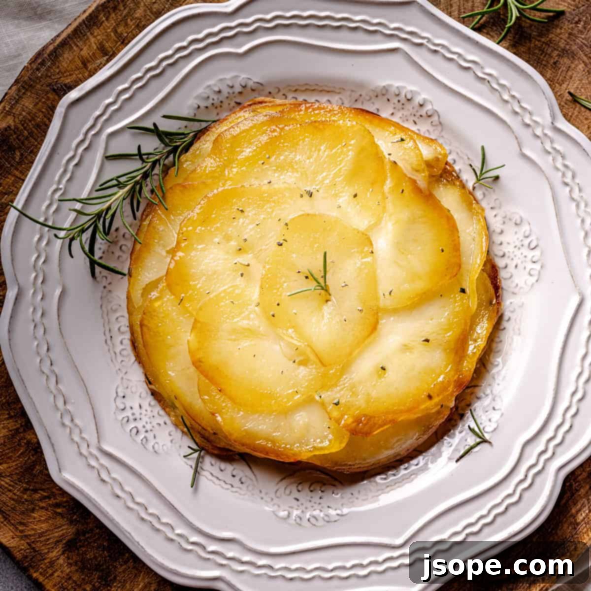 Golden Rosemary & Cheese Potato Gratin 2 Cheesy Layered Rosemary Potatoes – A gourmet twist on classic scalloped potatoes with Fontina and rosemary.