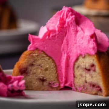 Boozy White Chocolate Raspberry Bundtinis - A delicious White Chocolate Raspberry Bundt Cake with boozy sauce and lemon mascarpone whipped cream. Perfect for celebrations.