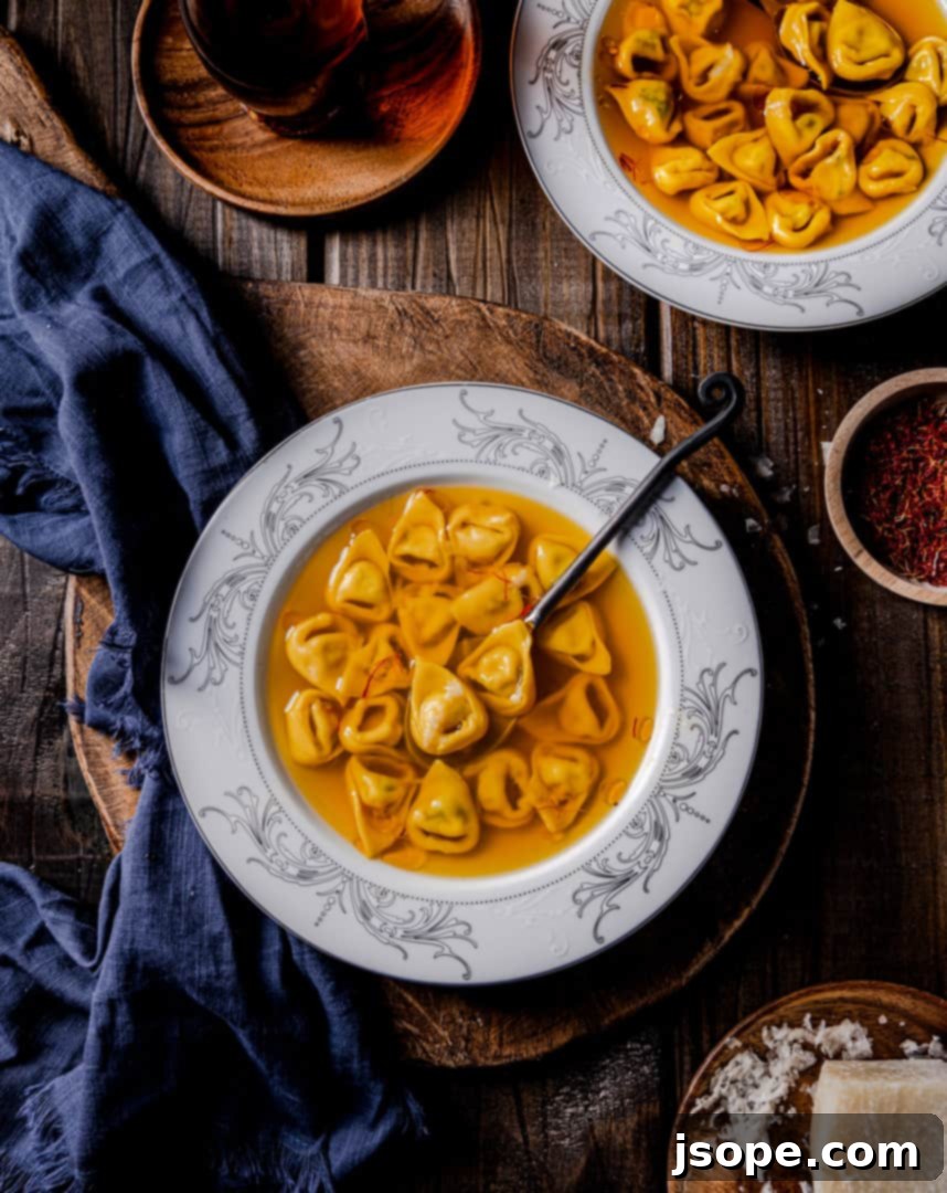 Vibrant Saffron Infused Vegetable Broth with fresh tortellini