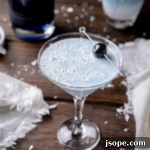 The Great 1908 Blizzard White Chocolate Cherry Cocktail, a stunning gin-based winter drink.