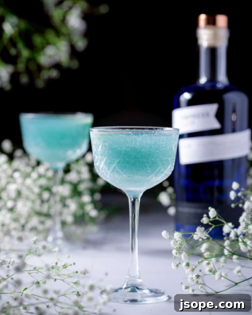 Blue Grotto Empress Gin Martini in a glass with a cucumber slice