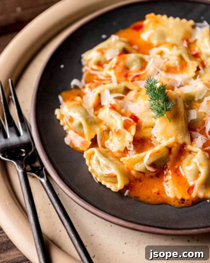 Close-up of Fava Bean Agnolotti del Plin before cooking, showing the delicate pinch marks and vibrant green filling visible through the pasta.