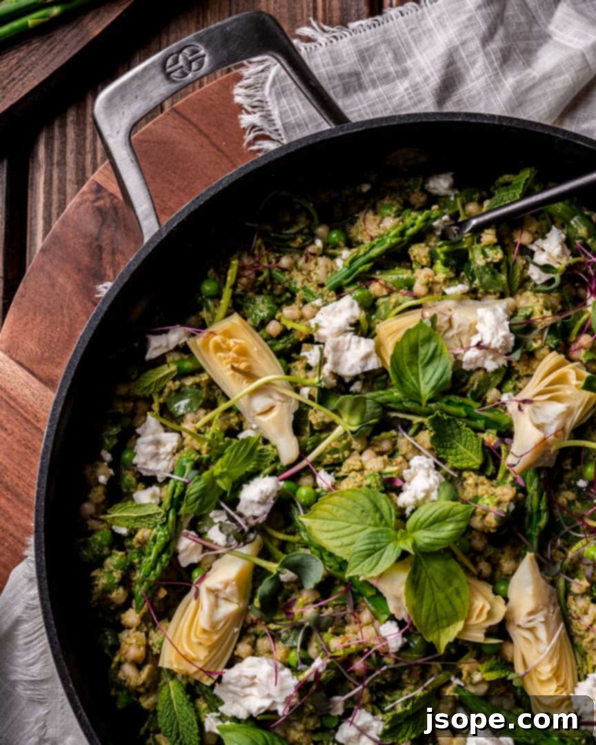 A tantalizing combination of spring greens and vegetables with creamy avocado pesto and couscous, inviting you to indulge.