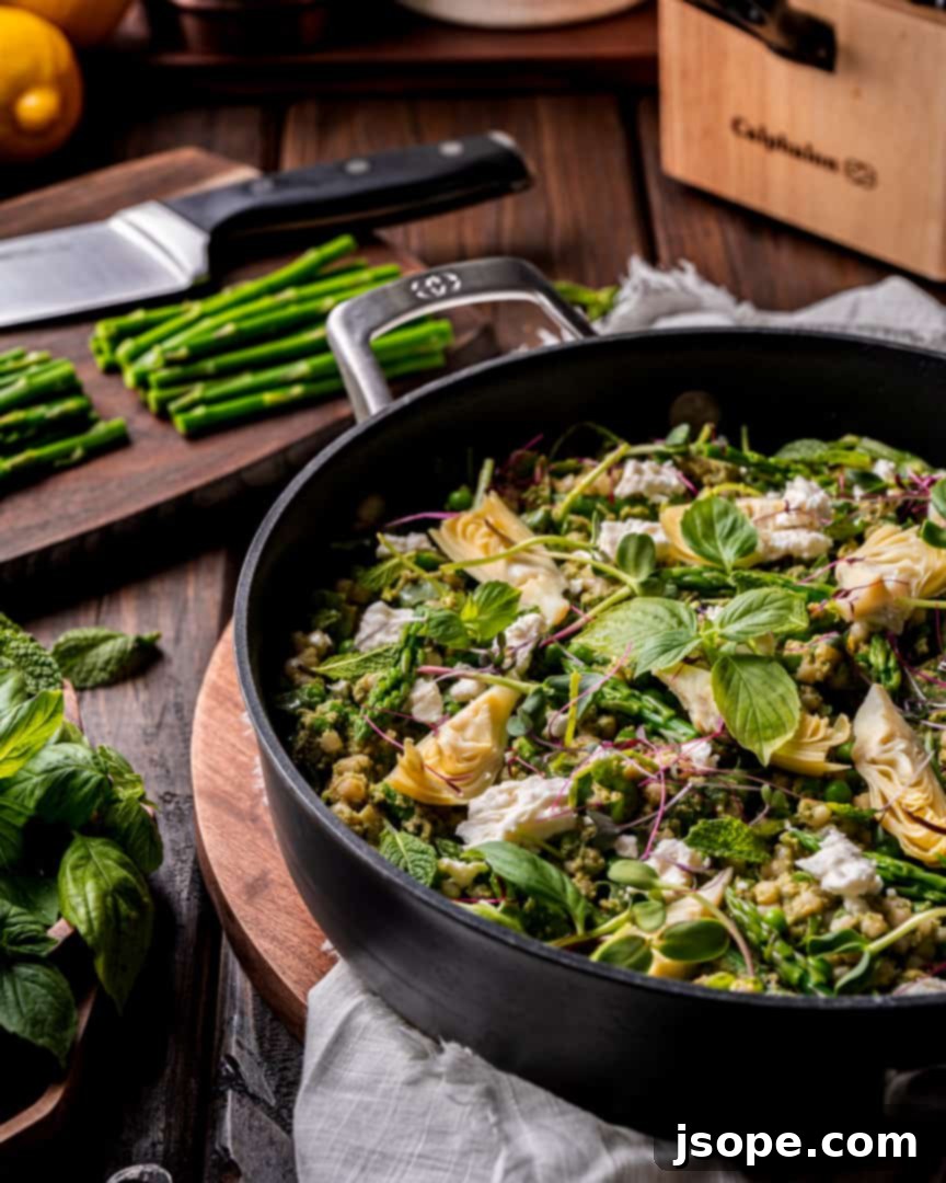 Avocado Pesto Couscous with Spring Greens presented beautifully in a bowl.