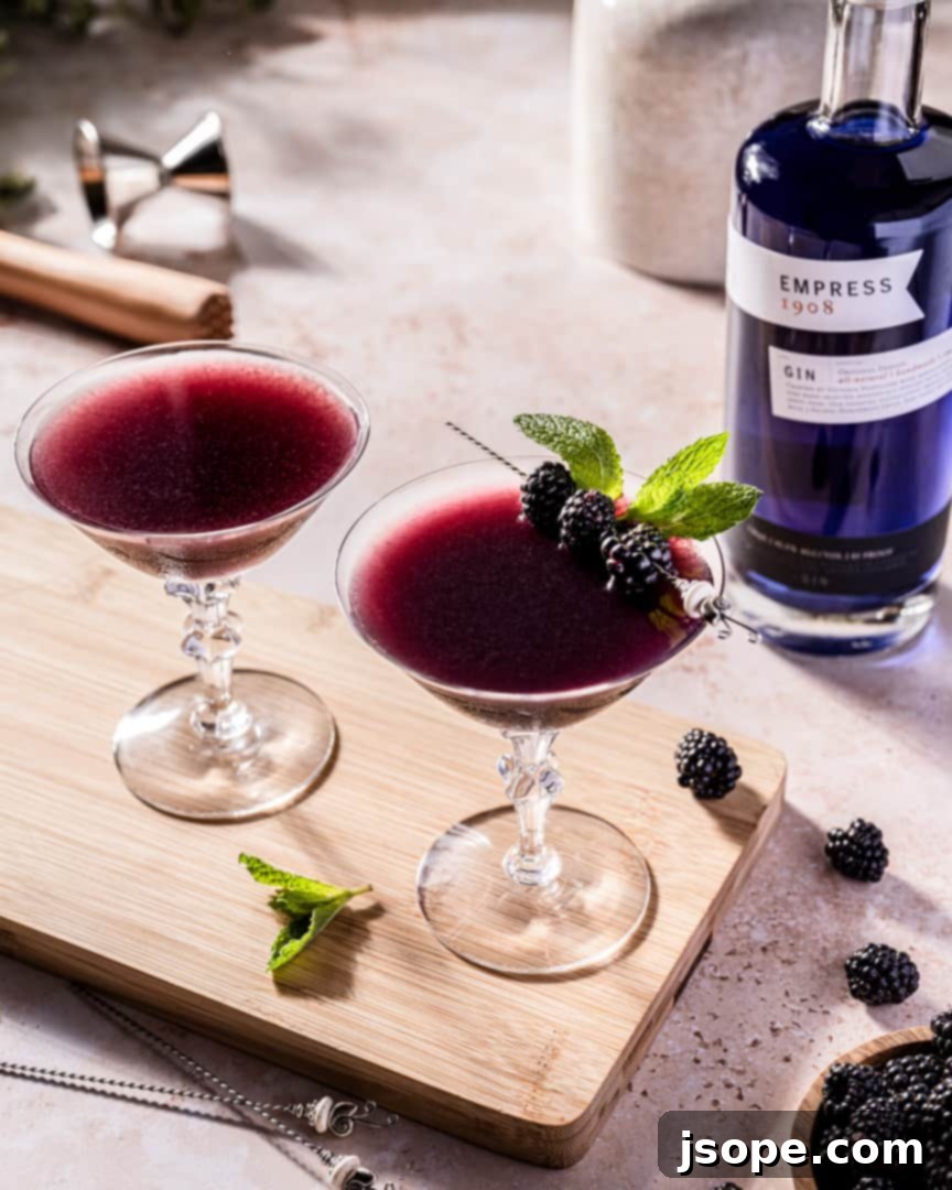 Blackberry Mint Gin Bliss 4 Muddled Blackberry Mint Gin Cocktail garnished with mint and blackberries