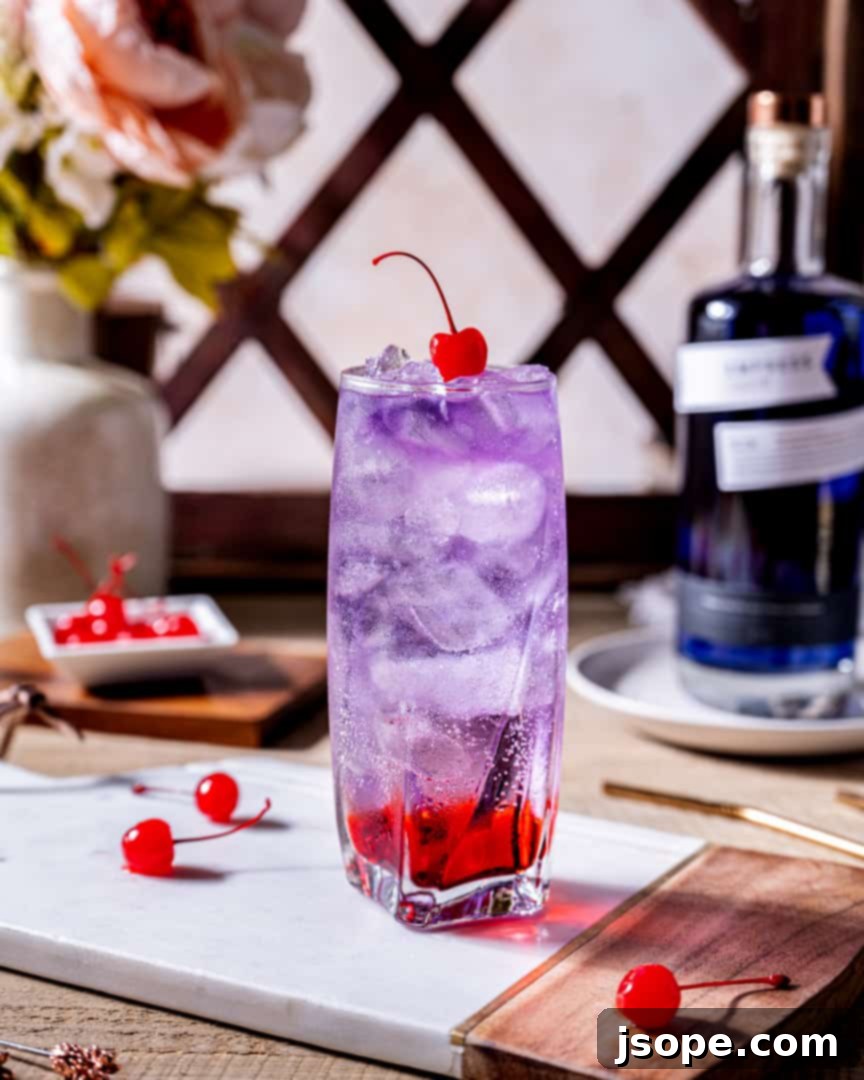 Empress Gin's Sophisticated Shirley 3 Ingredients for an Empress Dirty Shirley Gin Cocktail: Grenadine, Empress 1908 Gin, lemon-lime soda, and a maraschino cherry.