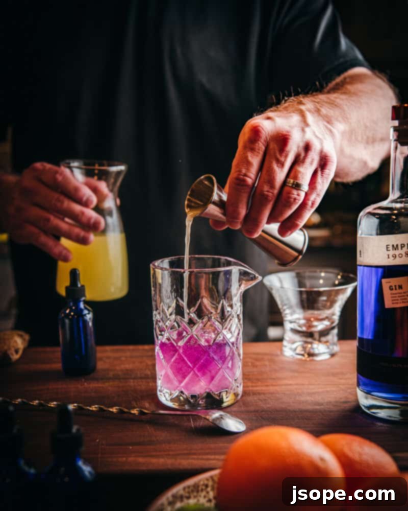 Step 7: The cocktail turns pink with the acidity of lemon juice