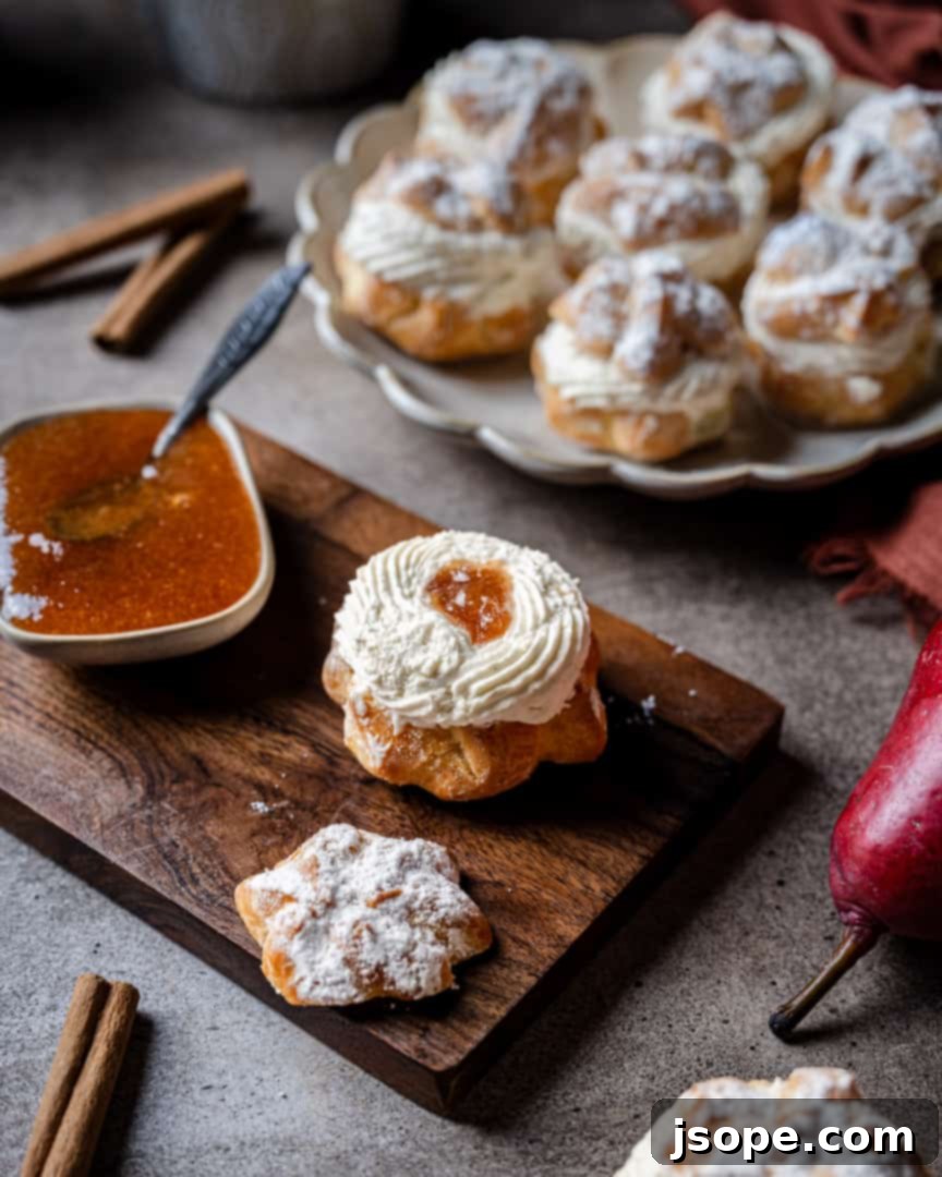 Beautifully plated Spiced Pear and Maple Cream Puffs, ready to be enjoyed