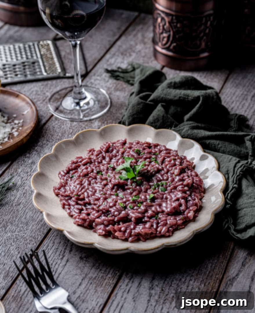 Risotto made with Cabernet Sauvignon and Parmesan cheese, served in a bowl.