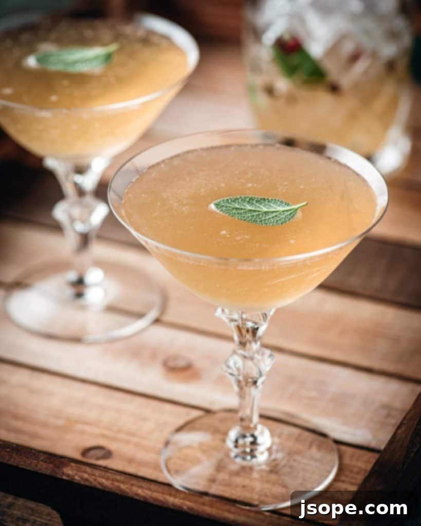 The Peppercorn-Kissed Pear & Sage Martini 2 Pear Sage and Pink Peppercorn Gin Martini - A unique, refreshing cocktail with herbaceous and spicy notes.