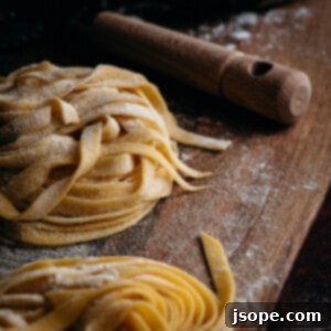 Homemade Multipurpose Pasta Dough, a golden ball of fresh pasta ready for rolling.